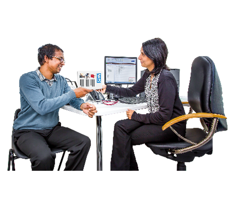 A GP (doctor) and patient in the GP (doctor's) practice. The GP is handing her patient an information sheet.