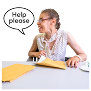 A woman sat at a desk opening an envelope. There is a speech bubble next to her which says 'Help please'
